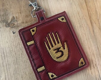 Oversized vinyl, Gravity Falls inspired Journal 3  luggage key fob. Vegan friendly