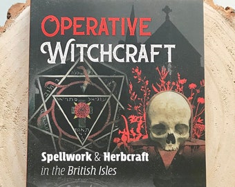 May include: A book titled "Operative Witchcraft: Spellwork & Herbcraft in the British Isles" by Nigel Pennick, author of "The Pagan Book of Days". The cover features a black and red illustration of a skull, a pentagram, and a church.