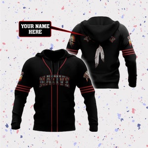 May include: Black baseball hoodie with red stripes and a Native American design. The front of the hoodie has the word "NATIVE" in colorful lettering. The back of the hoodie has a feather design and a Native American headdress.