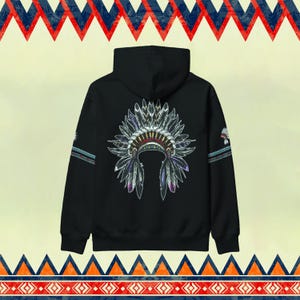 May include: Black hooded sweatshirt with a graphic print of a Native American headdress with feathers in shades of gray, purple, and white.