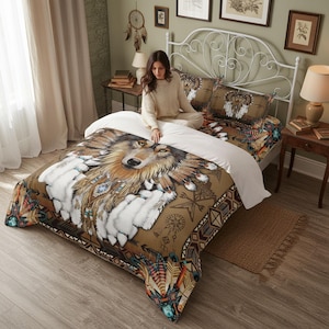 May include: A bedding set featuring a large, detailed illustration of a wolf wearing a feathered headdress. The design includes white fur accents, geometric patterns, and earthy brown tones. The set consists of a duvet cover and matching pillowcases.