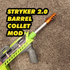 May include: A green and black Stryker 2.0 Nerf blaster with a grey grip and an orange barrel extension. The blaster has a purple and white design on the side.