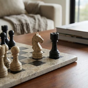 May include: A set of three ceramic nesting bowls in shades of blue, green, and white. The bowls feature a speckled glaze and a simple, modern design. The largest bowl measures approximately 6 inches in diameter.