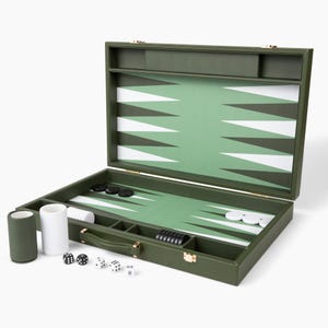 May include: Open olive green backgammon set with white and black game pieces. The board features a green playing surface with white and green triangles. Includes dice, dice cups, and a handle for easy transport.