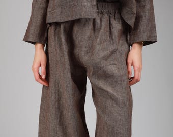 May include: A brown linen pajama set with a button-up top and elastic waist pants.