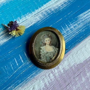 Antique Victorian hand painted miniature portrait brooch depicting a lady in noble dressed, antique metal gilt brooch with miniature