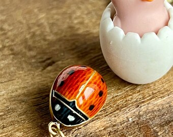 Vintage 1940s Guilloche enameled egg pendant with ladybug and vibrant blue