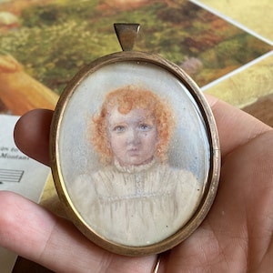 Late Victorian Hand Painted Miniature Portrait Pendant in brass, Antique Oval miniature painting of a lovely child in form of a pendant