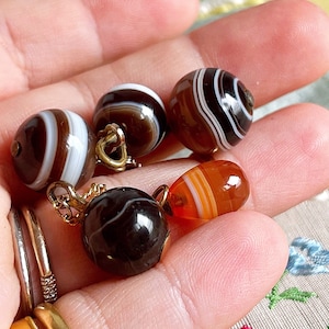 Victorian Banded Agate Ball Pendants: Orange, Brown, and Black Charms