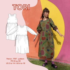 May include: A woman models an olive green dress with colourful abstract shapes against a bright wall. The dress features long sleeves and a gathered waist. The image also shows a dress pattern with the word "TORI". Text below indicates sizes, including UK sizes 6 to 18.