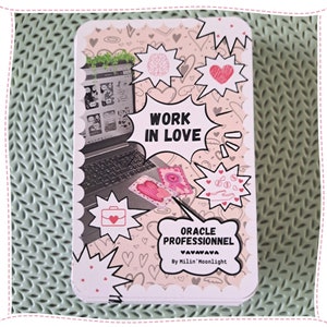 May include: A pink and white oracle card with the text "Work in Love" in a black speech bubble. The card has a pink and white background with hearts and other illustrations. The text "Oracle Professionnel" is also on the card.