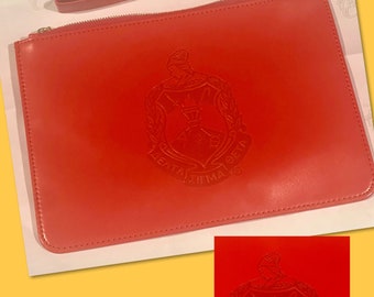 DST Vegan Leather Crest Embossed Wristlet