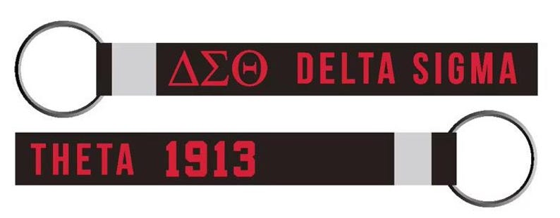 May include: Two black keyrings with silver rings. One keyring has the Greek letters Delta Sigma Theta in red, and the words DELTA SIGMA in red. The other keyring has the words THETA 1913 in red.