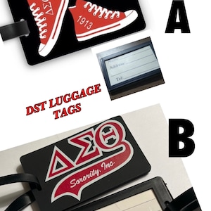 May include: Two black luggage tags with a black strap. One tag features a red and white pair of sneakers with the text "1913" on one shoe. The other tag features a red and white logo with the text "&Delta;&Sigma;&Theta; Sorority, Inc.". Both tags have a black and white label with blank spaces for name, address, and telephone number.