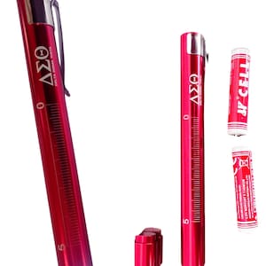May include: Red penlight with the text "DST PENLIGHT" and "2 AA BATTERIES INCLUDED". The penlight has a clip and a scale marked from 0 to 5. Includes two AA batteries. The penlight has the Greek letters Delta, Sigma, and Theta.