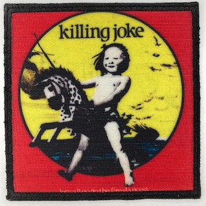 May include: Square patch with a red border and background. The patch features a yellow circle with a black and white illustration of a child riding a rocking horse. The text "killing joke" is above the illustration.