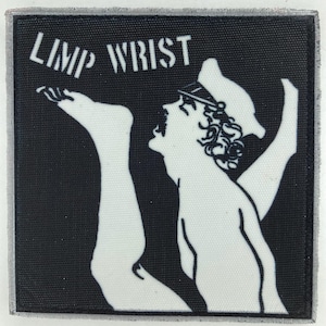 May include: A square black and white embroidered patch featuring a graphic illustration of a person wearing a cap with one leg raised high. The text LIMP WRIST is printed in white capital letters in the upper left corner of the patch.