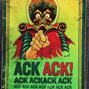 May include: A rectangular fabric patch featuring a graphic illustration of a Martian with a large brain, red eyes, and a skeletal face. The figure wears a red cape and green armor. Below, the text reads ACK ACK! ACK ACKACK ACK ACK ACK ACK ACK.