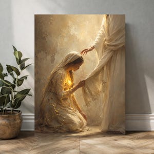 May include: A vertical wall art print depicting a kneeling figure in a cream-colored gown with glowing gold cracks, reaching out to touch the hem of a standing figure draped in flowing white robes against a textured, neutral-toned background.