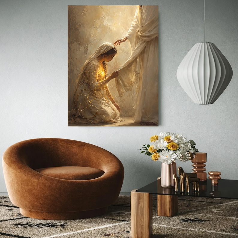 May include: A vertical wall art print depicting a kneeling figure in a white robe reaching out to touch the hem of a standing figure draped in flowing white fabric. The scene is rendered in warm, golden, and cream tones with soft lighting.