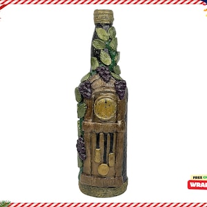 May include: A decorative glass bottle with a green, brown, and purple design. The bottle is shaped like a grandfather clock with a clock face and pendulum.
