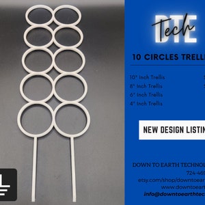 May include: White plastic 10-circle trellis for plants. The trellis is 10 inches tall and has 10 circles of varying sizes. The trellis is on a gray background.  "DTE Tech" and "10 Circles Trellis" are written in white text on a blue background.  The text "New Design Listing" is written in white text on a blue background.  The text "Down to Earth Technologies" is written in white text on a blue background.  The text "724-469-0886" is written in white text on a blue background.  The text "etsy.com/shop/downtoearthtech" is written in white text on a blue background.  The text "www.downtoearth.tech" is written in white text on a blue background.  The text "info@downtoearthtech.com" is written in white text on a blue background.