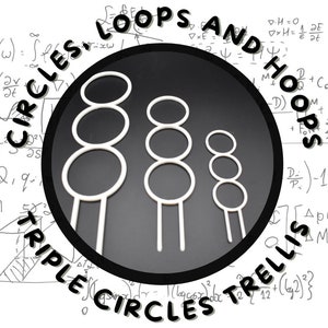 May include: Three white plastic hoops of different sizes, stacked on top of each other, with a black background. The text "LOOPS AND HOOPS" is written in white on a black background, and the text "TRIPLE CIRCLES TRELLIS" is written in white on a black background.