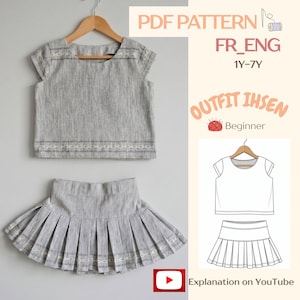 May include: A grey textured two-piece set consisting of a short-sleeved top and a pleated skirt with white embroidered detailing. The image includes text: PDF PATTERN FR_ENG 1Y-7Y, OUTFIT IHSEN, Beginner, and Explanation on YouTube with a diagram.