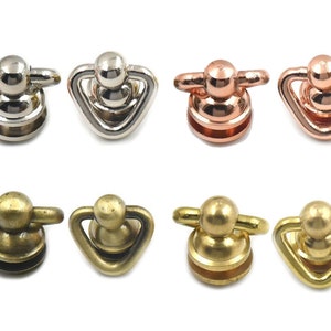 May include: Six metal swivel snap hooks in three different finishes: silver, rose gold, and brass. Each hook has a round ball on top and a triangular loop on the bottom.