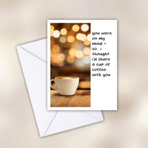May include: A greeting card with a coffee cup image and the text "you were on my mind ~ so, i thought i'd share a cup of coffee with you." The card is white, with a white envelope.