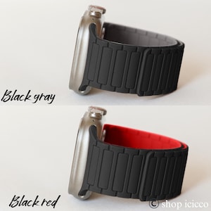May include: A silver smartwatch with a black and gray band and a black and red band. The text "Black gray" and "Black red" are written in cursive on the left side of the image.
