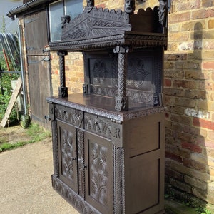 c1870 Gothic revival highly carved Oak cabinet.