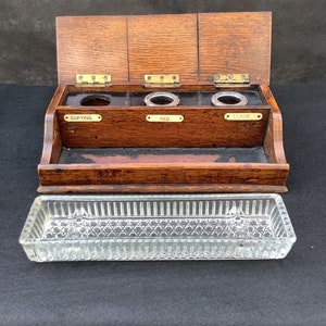 Antique Edwardian clerks oak desk ink well bank with original cut glass tray, vintage writing aid.