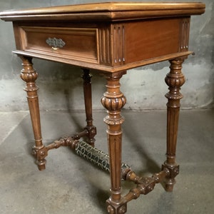 19th c antique mahogany sewing table with fold out velvet top.