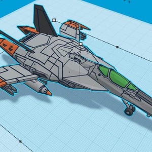 Puede incluir: Modelo estilizado de avi&oacute;n de combate a reacci&oacute;n gris y naranja con una cabina verde. El modelo tiene l&iacute;neas de panel detalladas y est&aacute; sobre un fondo de cuadr&iacute;cula azul claro. Las alas y la cola tienen detalles en naranja.