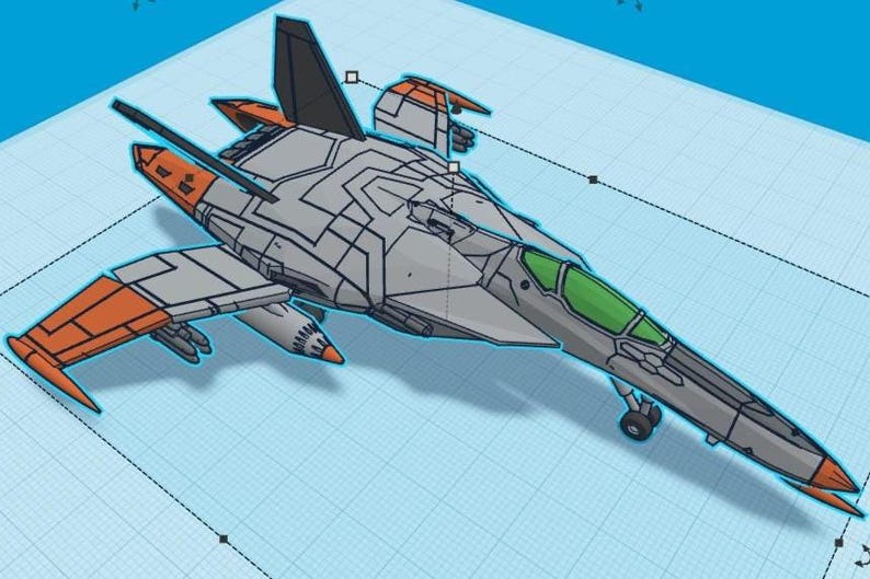 Puede incluir: Modelo estilizado de avi&oacute;n de combate a reacci&oacute;n gris y naranja con una cabina verde. El modelo tiene l&iacute;neas de panel detalladas y est&aacute; sobre un fondo de cuadr&iacute;cula azul claro. Las alas y la cola tienen detalles en naranja.
