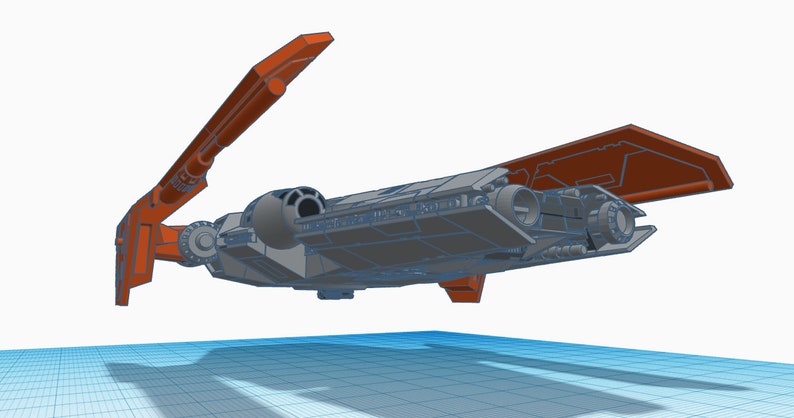 Peut inclure: Un mod&egrave;le de vaisseau spatial gris avec des ailes orange. Les ailes sont ouvertes et le vaisseau spatial est en l&eacute;vitation dans les airs.