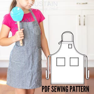 May include: A gray apron with thin white vertical stripes, featuring a small chest pocket and two large lower pockets. The apron includes a neck strap and side ties. A black and white line drawing of the apron pattern is displayed alongside.