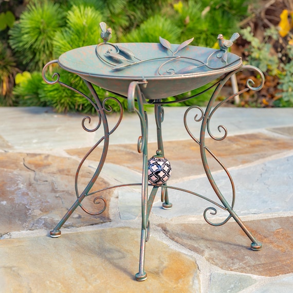 Deep Metal Birdbath with 2 Cast Iron Birds on Rim, Branch and Leaf Detail in Basin, and Porcelain Ball Accent Decoration on Stand