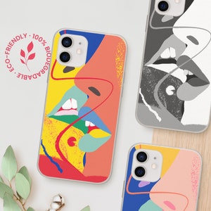 May include: Phone cases with colorful abstract art designs. One case features a vibrant design with red, yellow, blue, and pink, depicting two faces. Another case has a black and white design. The cases are eco-friendly and biodegradable.