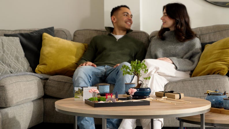 The Zen garden kit arranged in a lounge, creating a peaceful scene that evokes a sense of calm and focus—perfect for meditation or mindfulness moments.