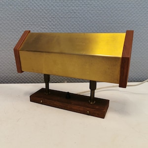 The rare Fuga wall light in solid brass and teak was designed by Jo Hammerborg for Fog & Mørup in 1966.