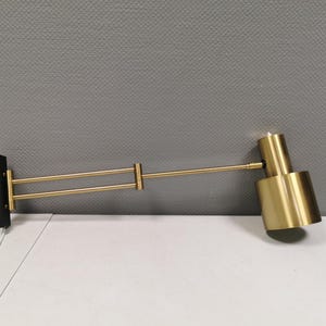 One of the rare Horisont wall lamps in brass, designed by Jo Hammerborg in 1969, for Danish Fog&Mørup.