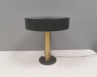 Danish table lamp with a solid brass base and a grey lacquered metal shade.