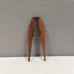 Solid teak nutcracker with brass fittings, designed by Poul Knudsen and made by Carl Auböck, estimated 1950-60s.