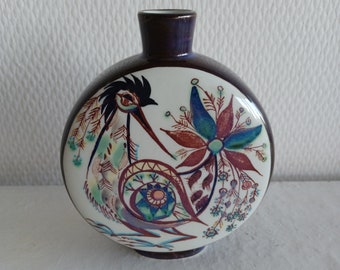 A very nice bottle vase shape with bird motif from Danish Royal Copenhagen in the 60s.  Designed by Marianne Johanson, numbered and signed