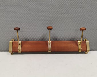 Danish teak and brass coat rack with adjustable hooks, 1960s.