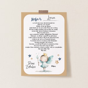 May include: A framed print with a handwritten letter addressed to "Lara" in German. The print features a watercolor illustration of a fairy with a wand, stars, and the text "Deine Zahnfee."