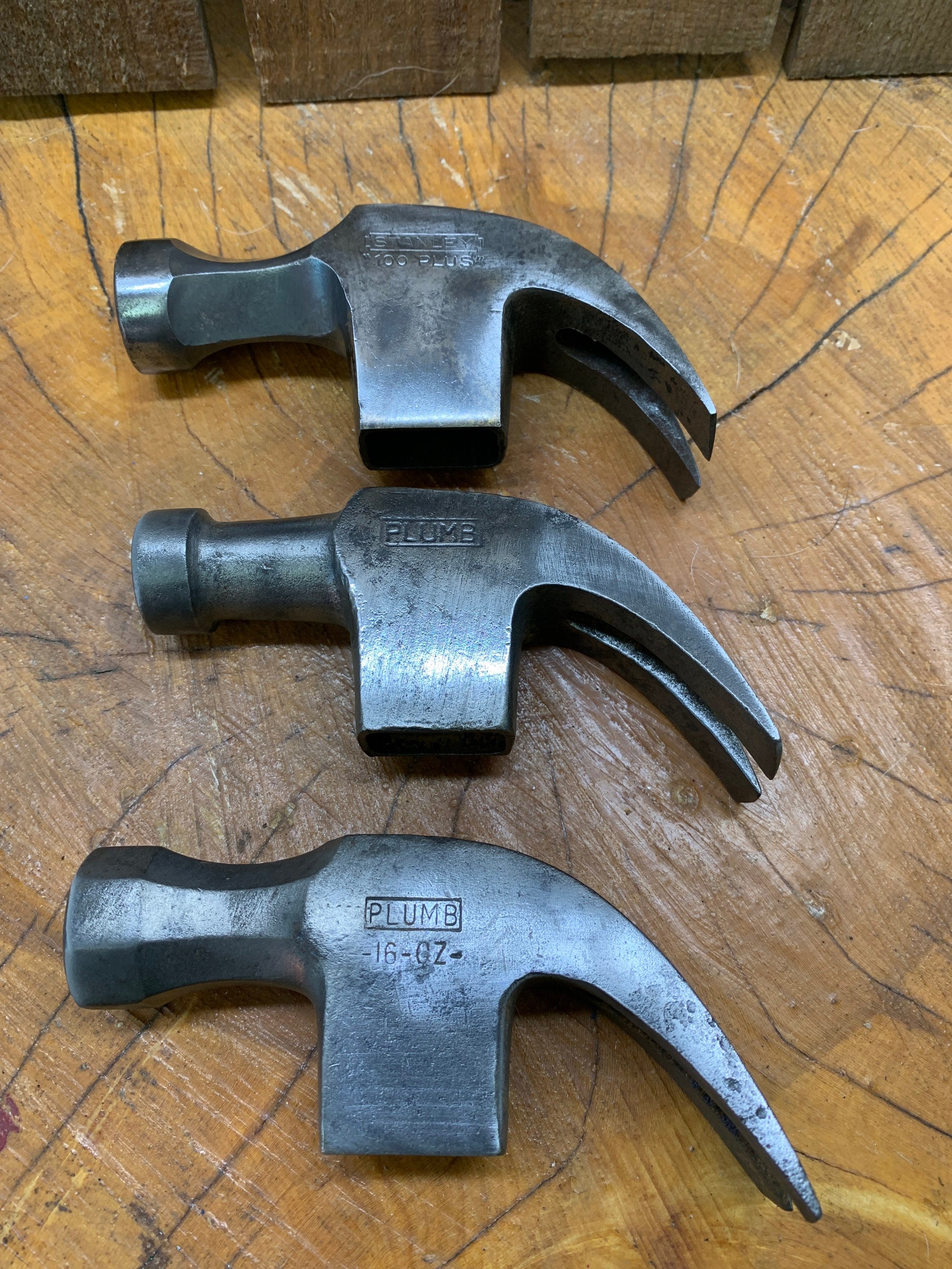 Two vintage unmarked Hammers One masonry Hammer and one claw Hammer