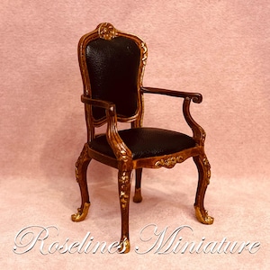 Miniature Dollhouse armchair with black leather. Dollhouse miniatures in 1:12